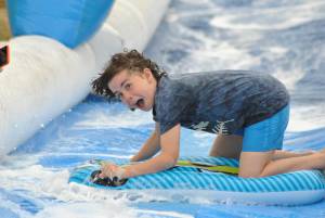 Ilminster Town FC fun day Part 7 – July 9, 2016: A giant water slide was the star attraction at a family fun day held to celebrate Ilminster Town Football Club’s new Archie Gooch Pavilion headquarters in Britten’s Field. Photo 15