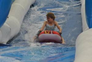 Ilminster Town FC fun day Part 7 – July 9, 2016: A giant water slide was the star attraction at a family fun day held to celebrate Ilminster Town Football Club’s new Archie Gooch Pavilion headquarters in Britten’s Field. Photo 18