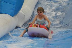 Ilminster Town FC fun day Part 7 – July 9, 2016: A giant water slide was the star attraction at a family fun day held to celebrate Ilminster Town Football Club’s new Archie Gooch Pavilion headquarters in Britten’s Field. Photo 19