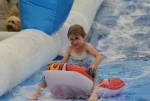 Ilminster Town FC fun day Part 7 – July 9, 2016: A giant water slide was the star attraction at a family fun day held to celebrate Ilminster Town Football Club’s new Archie Gooch Pavilion headquarters in Britten’s Field. Photo 20