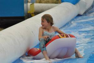 Ilminster Town FC fun day Part 7 – July 9, 2016: A giant water slide was the star attraction at a family fun day held to celebrate Ilminster Town Football Club’s new Archie Gooch Pavilion headquarters in Britten’s Field. Photo 21