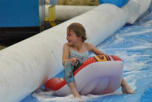 Ilminster Town FC fun day Part 7 – July 9, 2016: A giant water slide was the star attraction at a family fun day held to celebrate Ilminster Town Football Club’s new Archie Gooch Pavilion headquarters in Britten’s Field. Photo 21