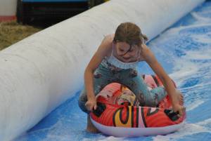 Ilminster Town FC fun day Part 7 – July 9, 2016: A giant water slide was the star attraction at a family fun day held to celebrate Ilminster Town Football Club’s new Archie Gooch Pavilion headquarters in Britten’s Field. Photo 22