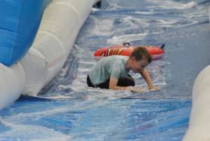 Ilminster Town FC fun day Part 7 – July 9, 2016: A giant water slide was the star attraction at a family fun day held to celebrate Ilminster Town Football Club’s new Archie Gooch Pavilion headquarters in Britten’s Field. Photo 24