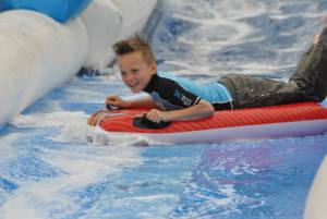 Ilminster Town FC fun day Part 7 – July 9, 2016: A giant water slide was the star attraction at a family fun day held to celebrate Ilminster Town Football Club’s new Archie Gooch Pavilion headquarters in Britten’s Field. Photo 25