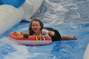 Ilminster Town FC fun day Part 7 – July 9, 2016: A giant water slide was the star attraction at a family fun day held to celebrate Ilminster Town Football Club’s new Archie Gooch Pavilion headquarters in Britten’s Field. Photo 27