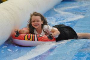 Ilminster Town FC fun day Part 7 – July 9, 2016: A giant water slide was the star attraction at a family fun day held to celebrate Ilminster Town Football Club’s new Archie Gooch Pavilion headquarters in Britten’s Field. Photo 28