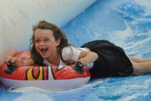 Ilminster Town FC fun day Part 7 – July 9, 2016: A giant water slide was the star attraction at a family fun day held to celebrate Ilminster Town Football Club’s new Archie Gooch Pavilion headquarters in Britten’s Field. Photo 29