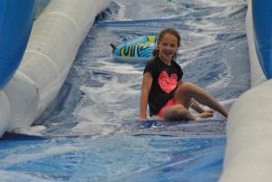 Ilminster Town FC fun day Part 7 – July 9, 2016: A giant water slide was the star attraction at a family fun day held to celebrate Ilminster Town Football Club’s new Archie Gooch Pavilion headquarters in Britten’s Field. Photo 30