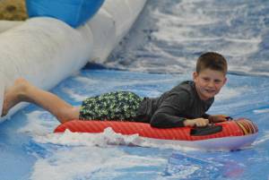 Ilminster Town FC fun day Part 7 – July 9, 2016: A giant water slide was the star attraction at a family fun day held to celebrate Ilminster Town Football Club’s new Archie Gooch Pavilion headquarters in Britten’s Field. Photo 3