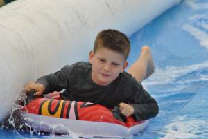 Ilminster Town FC fun day Part 7 – July 9, 2016: A giant water slide was the star attraction at a family fun day held to celebrate Ilminster Town Football Club’s new Archie Gooch Pavilion headquarters in Britten’s Field. Photo 4