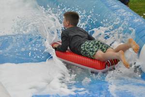 Ilminster Town FC fun day Part 7 – July 9, 2016: A giant water slide was the star attraction at a family fun day held to celebrate Ilminster Town Football Club’s new Archie Gooch Pavilion headquarters in Britten’s Field. Photo 5