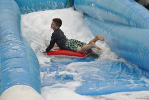 Ilminster Town FC fun day Part 7 – July 9, 2016: A giant water slide was the star attraction at a family fun day held to celebrate Ilminster Town Football Club’s new Archie Gooch Pavilion headquarters in Britten’s Field. Photo 6