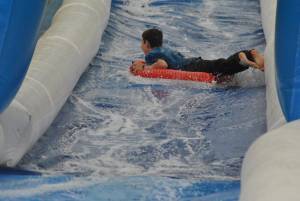 Ilminster Town FC fun day Part 7 – July 9, 2016: A giant water slide was the star attraction at a family fun day held to celebrate Ilminster Town Football Club’s new Archie Gooch Pavilion headquarters in Britten’s Field. Photo 7