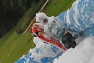 Ilminster Town FC fun day Part 8 – July 9, 2016: A giant water slide was the star attraction at a family fun day held to celebrate Ilminster Town Football Club’s new Archie Gooch Pavilion headquarters in Britten’s Field. Photo 10