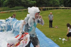 Ilminster Town FC fun day Part 8 – July 9, 2016: A giant water slide was the star attraction at a family fun day held to celebrate Ilminster Town Football Club’s new Archie Gooch Pavilion headquarters in Britten’s Field. Photo 12