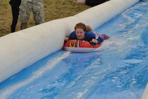 Ilminster Town FC fun day Part 8 – July 9, 2016: A giant water slide was the star attraction at a family fun day held to celebrate Ilminster Town Football Club’s new Archie Gooch Pavilion headquarters in Britten’s Field. Photo 13