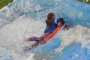 Ilminster Town FC fun day Part 8 – July 9, 2016: A giant water slide was the star attraction at a family fun day held to celebrate Ilminster Town Football Club’s new Archie Gooch Pavilion headquarters in Britten’s Field. Photo 14