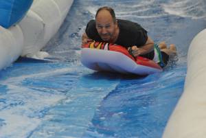Ilminster Town FC fun day Part 8 – July 9, 2016: A giant water slide was the star attraction at a family fun day held to celebrate Ilminster Town Football Club’s new Archie Gooch Pavilion headquarters in Britten’s Field. Photo 19