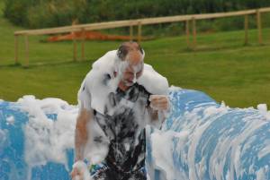 Ilminster Town FC fun day Part 8 – July 9, 2016: A giant water slide was the star attraction at a family fun day held to celebrate Ilminster Town Football Club’s new Archie Gooch Pavilion headquarters in Britten’s Field. Photo 25