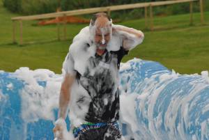 Ilminster Town FC fun day Part 8 – July 9, 2016: A giant water slide was the star attraction at a family fun day held to celebrate Ilminster Town Football Club’s new Archie Gooch Pavilion headquarters in Britten’s Field. Photo 26