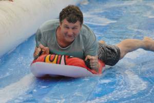 Ilminster Town FC fun day Part 8 – July 9, 2016: A giant water slide was the star attraction at a family fun day held to celebrate Ilminster Town Football Club’s new Archie Gooch Pavilion headquarters in Britten’s Field. Photo 5