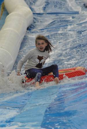 Ilminster Town FC fun day Part 9 – July 9, 2016:: A giant water slide was the star attraction at a family fun day held to celebrate Ilminster Town Football Club’s new Archie Gooch Pavilion headquarters in Britten’s Field. Photo 2