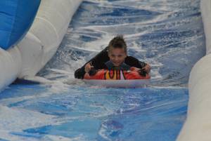 Ilminster Town FC fun day Part 9 – July 9, 2016:: A giant water slide was the star attraction at a family fun day held to celebrate Ilminster Town Football Club’s new Archie Gooch Pavilion headquarters in Britten’s Field. Photo 29