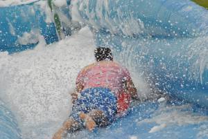 Ilminster Town FC fun day Part 9 – July 9, 2016:: A giant water slide was the star attraction at a family fun day held to celebrate Ilminster Town Football Club’s new Archie Gooch Pavilion headquarters in Britten’s Field. Photo 5