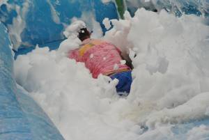 Ilminster Town FC fun day Part 9 – July 9, 2016:: A giant water slide was the star attraction at a family fun day held to celebrate Ilminster Town Football Club’s new Archie Gooch Pavilion headquarters in Britten’s Field. Photo 6
