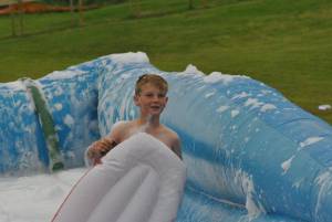 Ilminster Town FC fun day Part 10 – July 9, 2016: A giant water slide was the star attraction at a family fun day held to celebrate Ilminster Town Football Club’s new Archie Gooch Pavilion headquarters in Britten’s Field. Photo 11