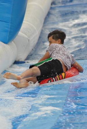 Ilminster Town FC fun day Part 10 – July 9, 2016: A giant water slide was the star attraction at a family fun day held to celebrate Ilminster Town Football Club’s new Archie Gooch Pavilion headquarters in Britten’s Field. Photo 12