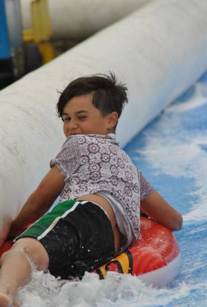 Ilminster Town FC fun day Part 10 – July 9, 2016: A giant water slide was the star attraction at a family fun day held to celebrate Ilminster Town Football Club’s new Archie Gooch Pavilion headquarters in Britten’s Field. Photo 13