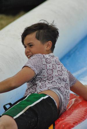 Ilminster Town FC fun day Part 10 – July 9, 2016: A giant water slide was the star attraction at a family fun day held to celebrate Ilminster Town Football Club’s new Archie Gooch Pavilion headquarters in Britten’s Field. Photo 14