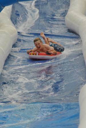 Ilminster Town FC fun day Part 10 – July 9, 2016: A giant water slide was the star attraction at a family fun day held to celebrate Ilminster Town Football Club’s new Archie Gooch Pavilion headquarters in Britten’s Field. Photo 5