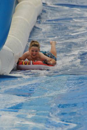 Ilminster Town FC fun day Part 10 – July 9, 2016: A giant water slide was the star attraction at a family fun day held to celebrate Ilminster Town Football Club’s new Archie Gooch Pavilion headquarters in Britten’s Field. Photo 6
