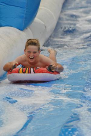Ilminster Town FC fun day Part 10 – July 9, 2016: A giant water slide was the star attraction at a family fun day held to celebrate Ilminster Town Football Club’s new Archie Gooch Pavilion headquarters in Britten’s Field. Photo 7