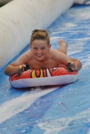 Ilminster Town FC fun day Part 10 – July 9, 2016: A giant water slide was the star attraction at a family fun day held to celebrate Ilminster Town Football Club’s new Archie Gooch Pavilion headquarters in Britten’s Field. Photo 8