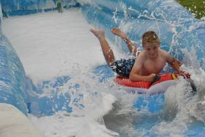 Ilminster Town FC fun day Part 10 – July 9, 2016: A giant water slide was the star attraction at a family fun day held to celebrate Ilminster Town Football Club’s new Archie Gooch Pavilion headquarters in Britten’s Field. Photo 9