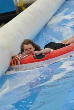 Ilminster Town FC fun day Part 11 – July 9, 2016: A giant water slide was the star attraction at a family fun day held to celebrate Ilminster Town Football Club’s new Archie Gooch Pavilion headquarters in Britten’s Field. Photo 18