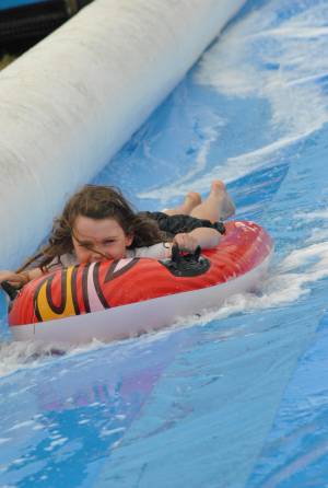 Ilminster Town FC fun day Part 11 – July 9, 2016: A giant water slide was the star attraction at a family fun day held to celebrate Ilminster Town Football Club’s new Archie Gooch Pavilion headquarters in Britten’s Field. Photo 19