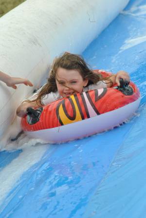 Ilminster Town FC fun day Part 11 – July 9, 2016: A giant water slide was the star attraction at a family fun day held to celebrate Ilminster Town Football Club’s new Archie Gooch Pavilion headquarters in Britten’s Field. Photo 20