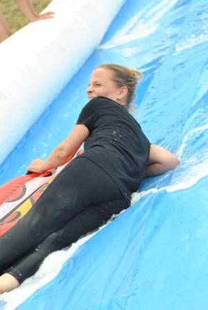 Ilminster Town FC fun day Part 11 – July 9, 2016: A giant water slide was the star attraction at a family fun day held to celebrate Ilminster Town Football Club’s new Archie Gooch Pavilion headquarters in Britten’s Field. Photo 21