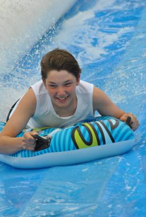 Ilminster Town FC fun day Part 11 – July 9, 2016: A giant water slide was the star attraction at a family fun day held to celebrate Ilminster Town Football Club’s new Archie Gooch Pavilion headquarters in Britten’s Field. Photo 25