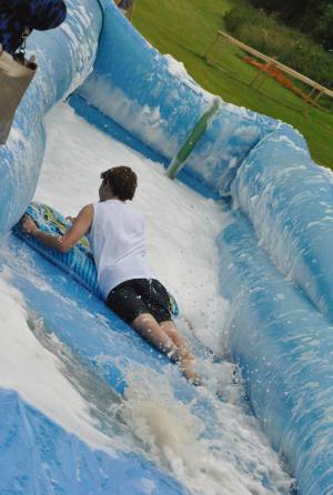 Ilminster Town FC fun day Part 11 – July 9, 2016: A giant water slide was the star attraction at a family fun day held to celebrate Ilminster Town Football Club’s new Archie Gooch Pavilion headquarters in Britten’s Field. Photo 26