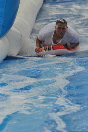Ilminster Town FC fun day Part 11 – July 9, 2016: A giant water slide was the star attraction at a family fun day held to celebrate Ilminster Town Football Club’s new Archie Gooch Pavilion headquarters in Britten’s Field. Photo 2