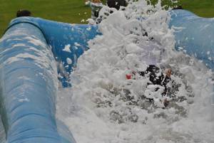 Ilminster Town FC fun day Part 11 – July 9, 2016: A giant water slide was the star attraction at a family fun day held to celebrate Ilminster Town Football Club’s new Archie Gooch Pavilion headquarters in Britten’s Field. Photo 6