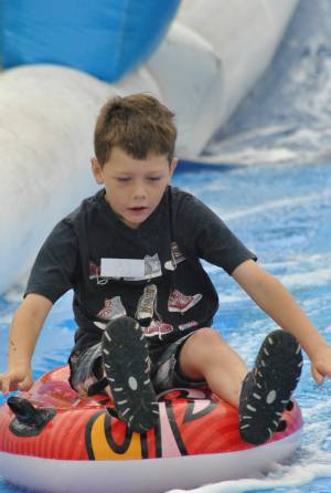 Ilminster Town FC fun day Part 12 – July 9, 2016: A giant water slide was the star attraction at a family fun day held to celebrate Ilminster Town Football Club’s new Archie Gooch Pavilion headquarters in Britten’s Field. Photo 11