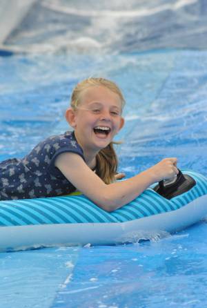 Ilminster Town FC fun day Part 12 – July 9, 2016: A giant water slide was the star attraction at a family fun day held to celebrate Ilminster Town Football Club’s new Archie Gooch Pavilion headquarters in Britten’s Field. Photo 13