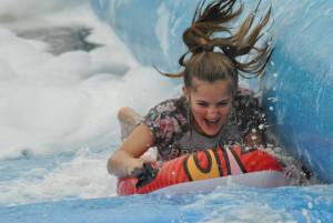 Ilminster Town FC fun day Part 12 – July 9, 2016: A giant water slide was the star attraction at a family fun day held to celebrate Ilminster Town Football Club’s new Archie Gooch Pavilion headquarters in Britten’s Field. Photo 15